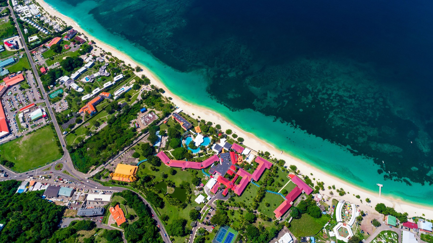 Aerial view of the turquoise water and white sands at Grand Anse Beach, Grenada